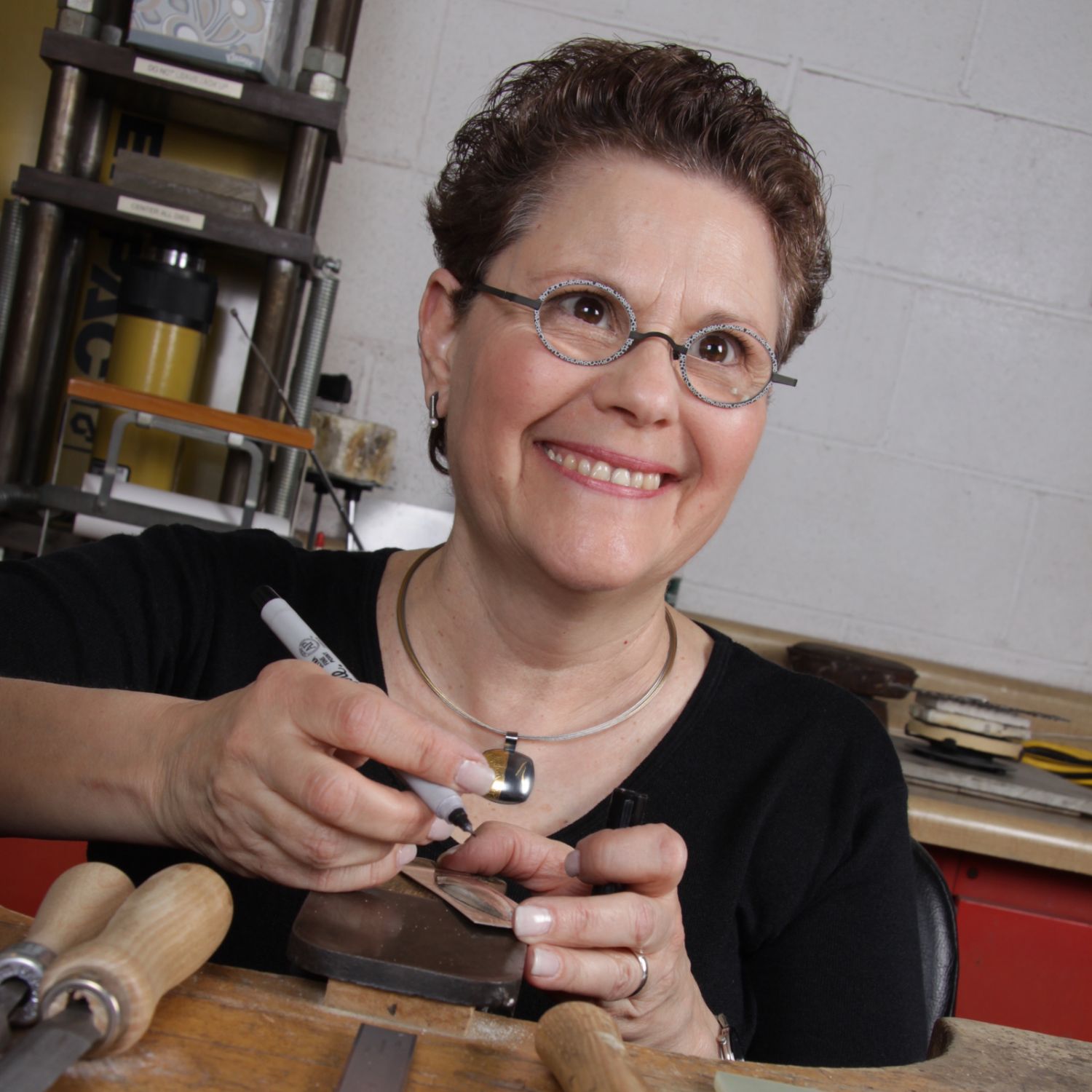 Portrait of Estelle Vernon, the mastermind behind unique and elegant jewelry designs."