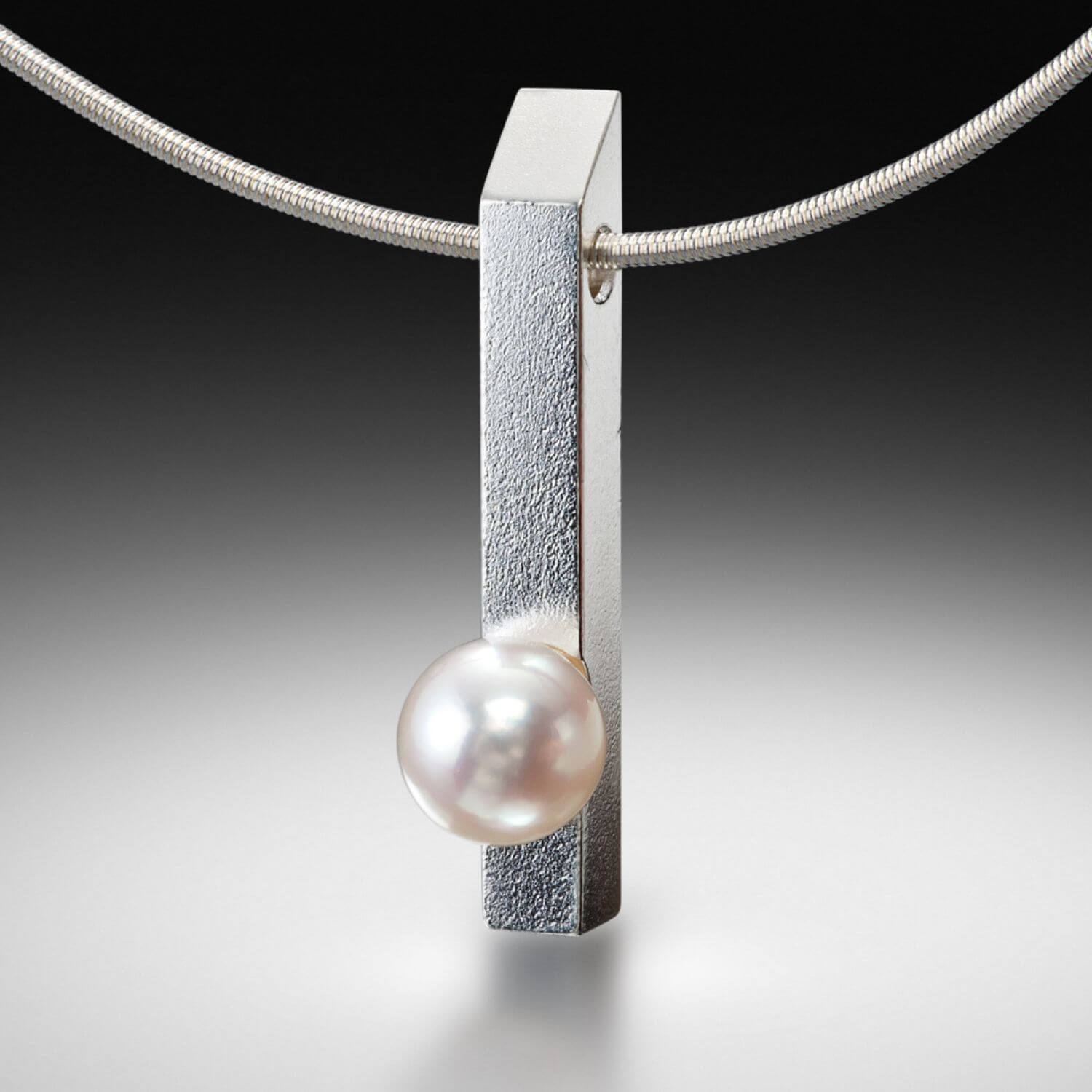 A close-up view of Estelle Vernon's elegant pearl jewelry collection, embodying timeless simplicity.